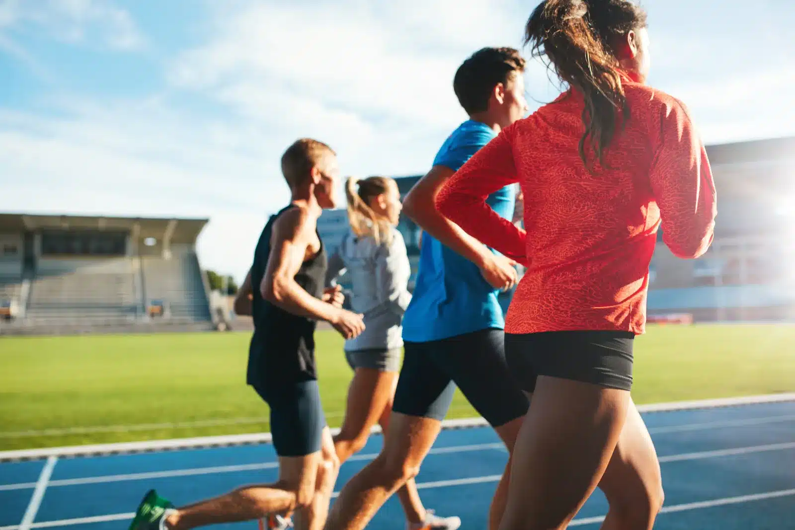 group of runners training on a sports track
